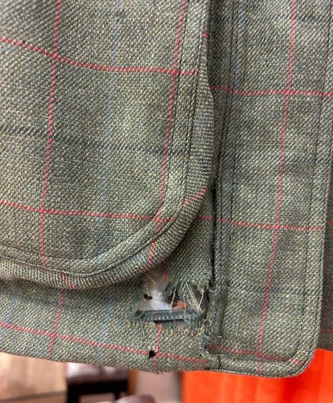 Tweed jacket with moth holes, before repair, view 2